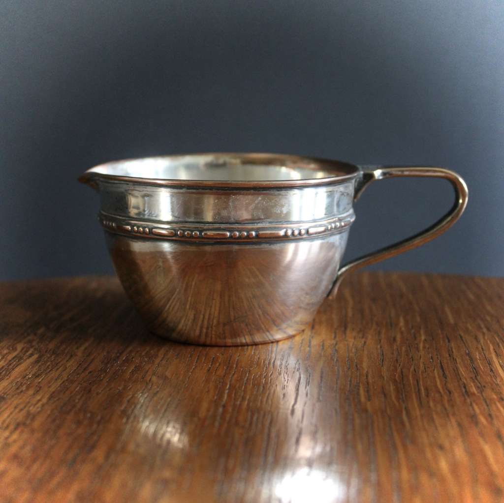 W.A.S Benson silver plated on copper milk jug