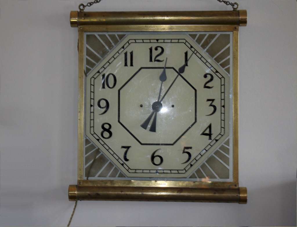 1930's brass illuminated Cinema clock. Made in England by 