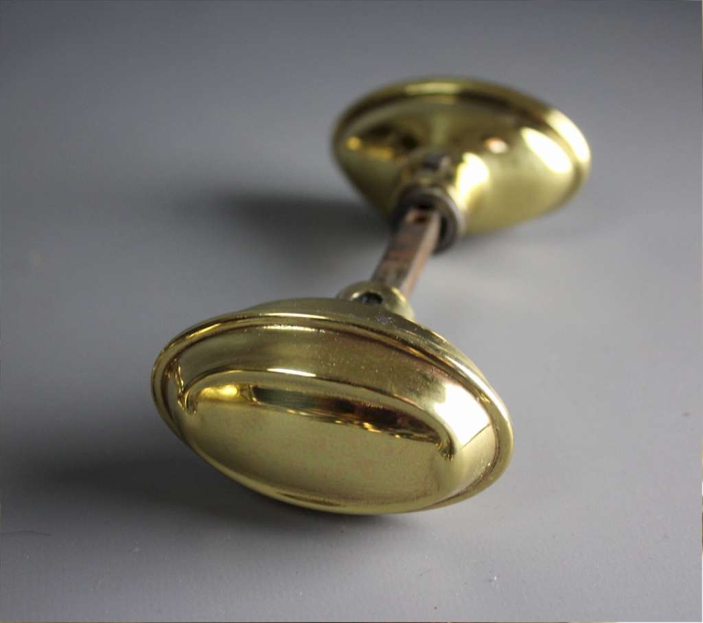 Edwardian brass door knobs with back plates