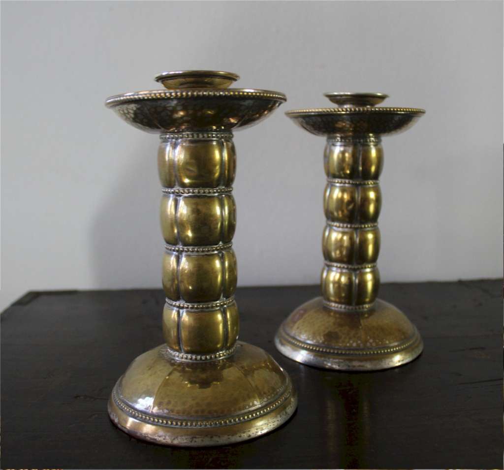 Pair of brass arts and crafts candlesticks