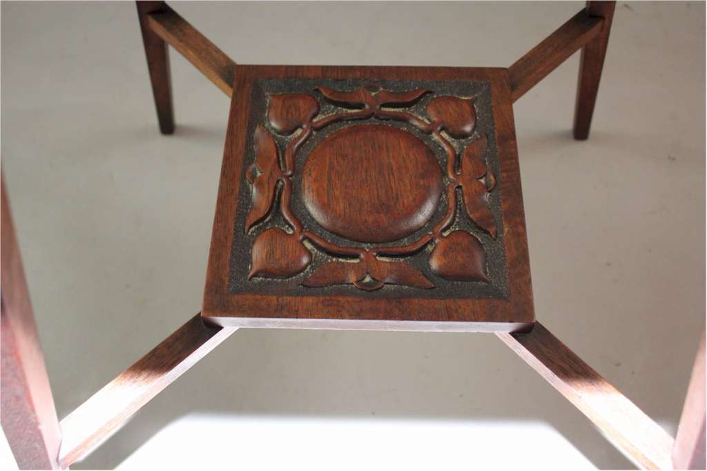 Arts and crafts table with carved birds c1900