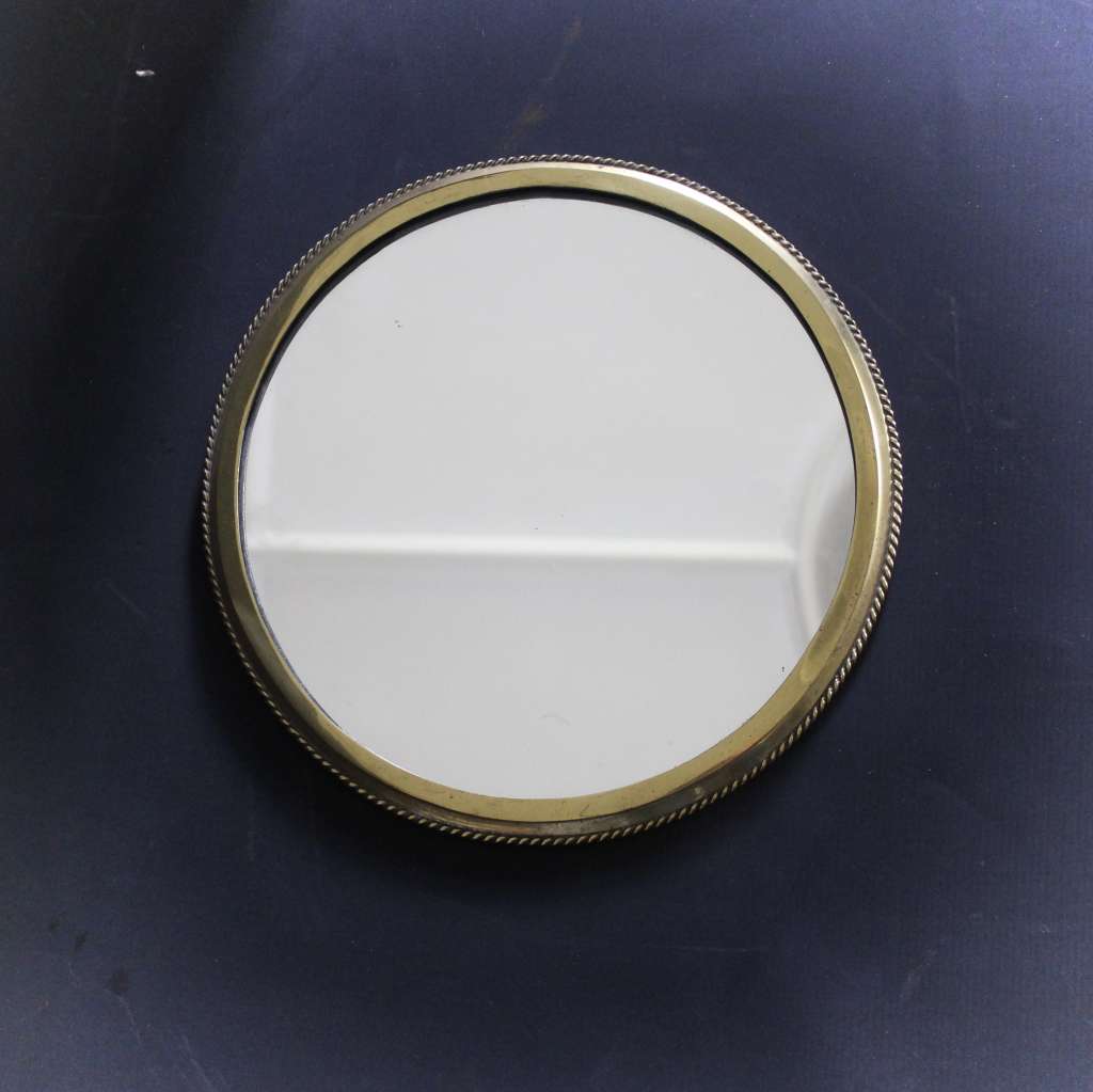 Circular brass ribbed wall mirror