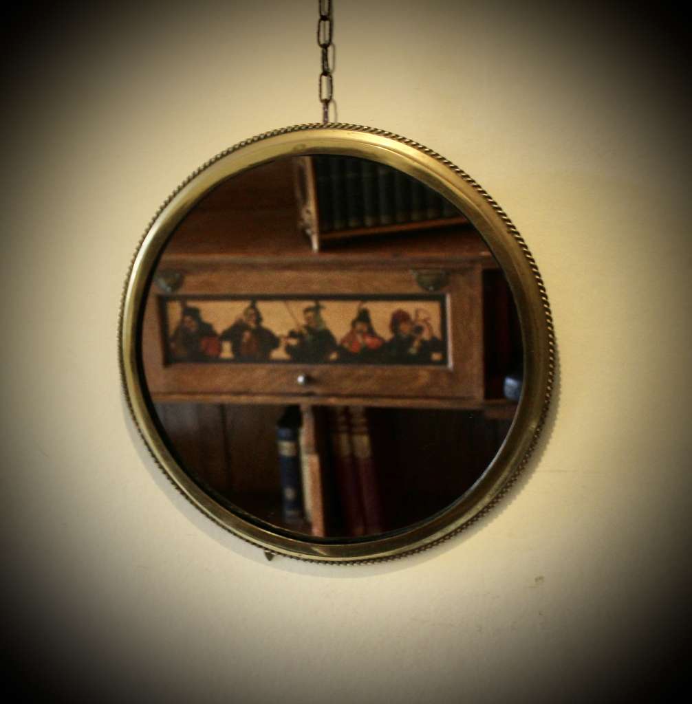 Circular brass ribbed wall mirror