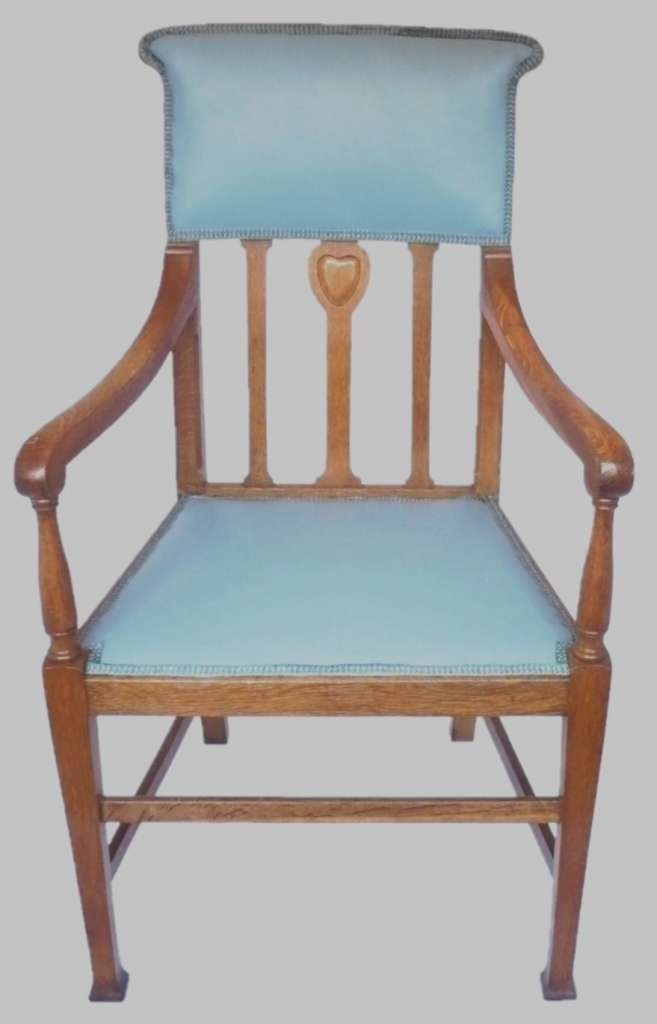 Arts and crafts armchair with carved heart decoration
