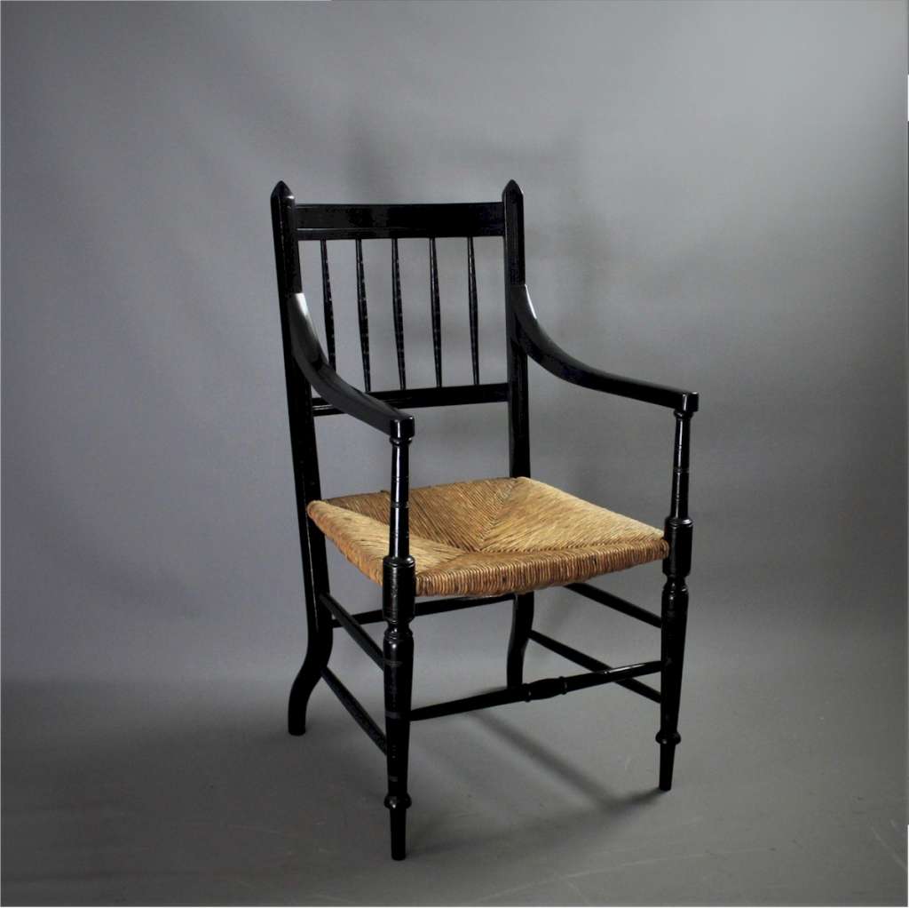 Aesthetic Ebonised rushed elbow chair
