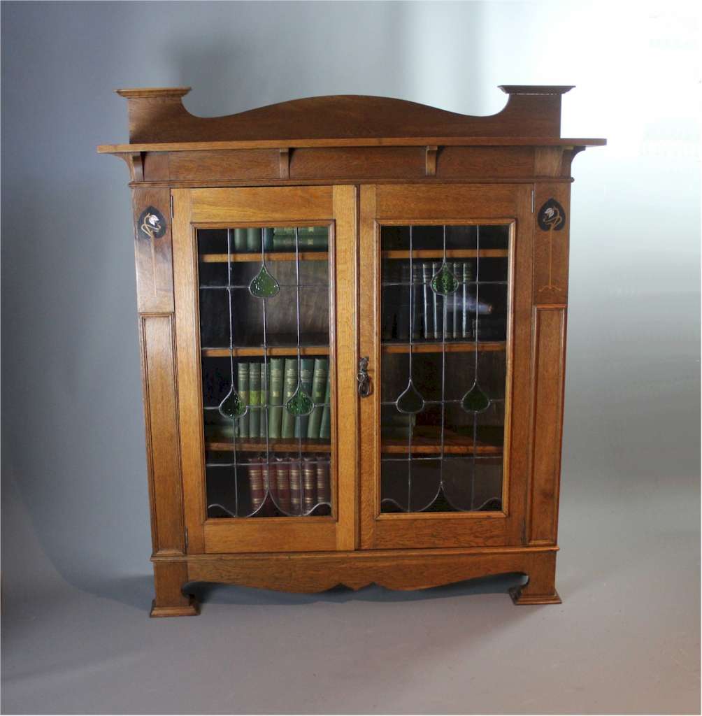 Arts and Crafts pewter and Ebony inlaid bookcase