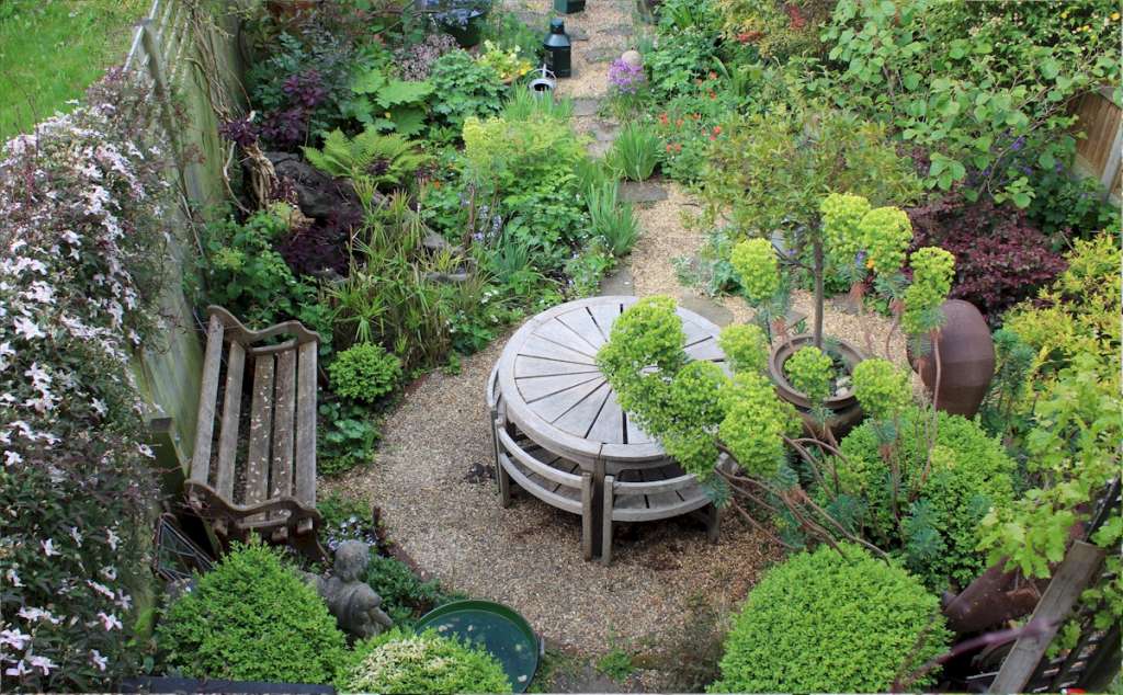 Rare weathered teak garden set by Hughes Bolckow