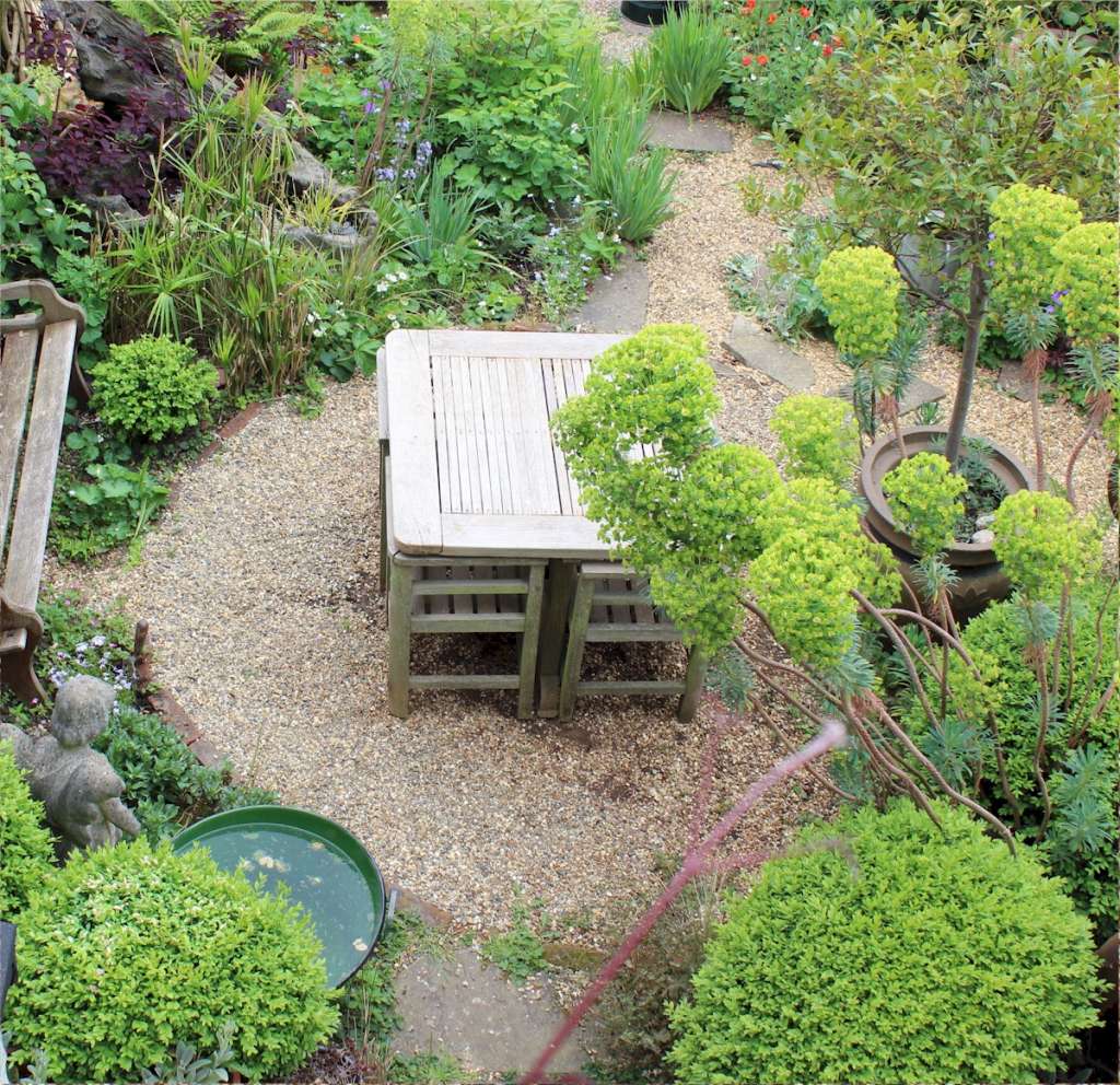 Weathered teak garden set retailed through Heals