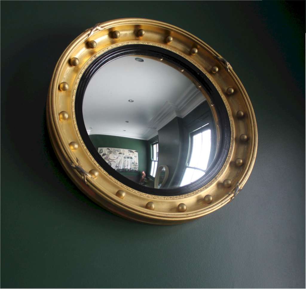 Gilt regency style convex mirror.