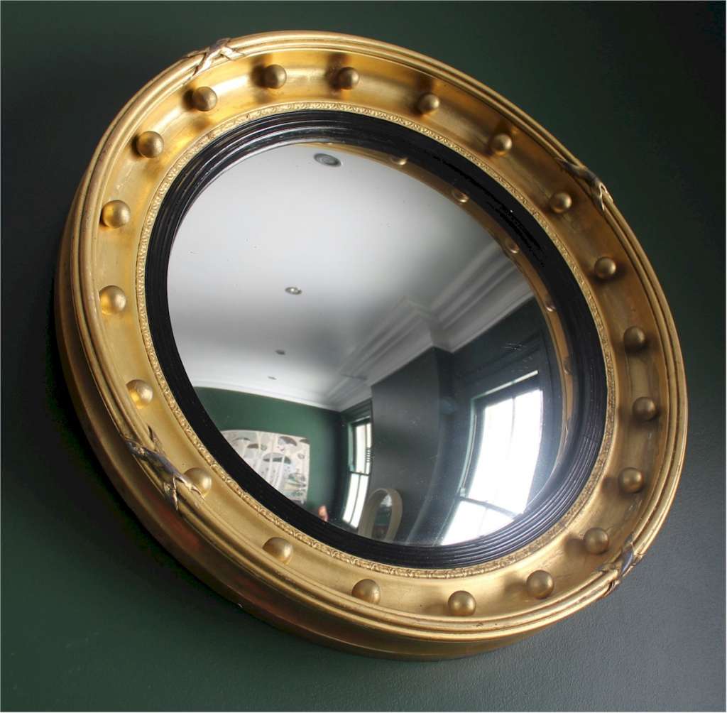 Gilt regency style convex mirror.