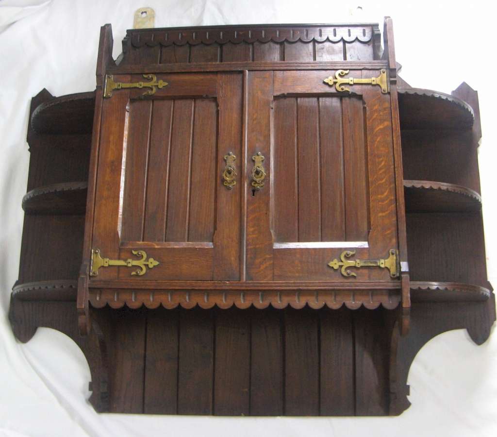 A Gothic oak hanging wall cabinet