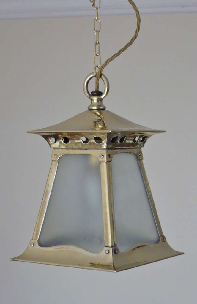 Good run of arts and crafts lanterns in brass