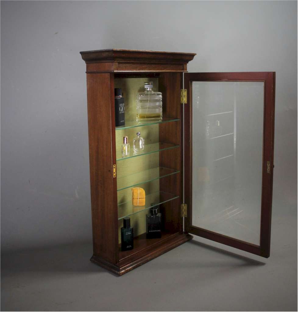 Mahogany perfume shop display cabinet.