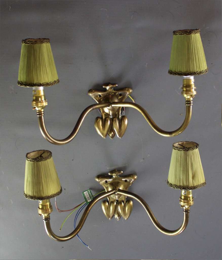 Pair of arts and crafts brass wall lights.