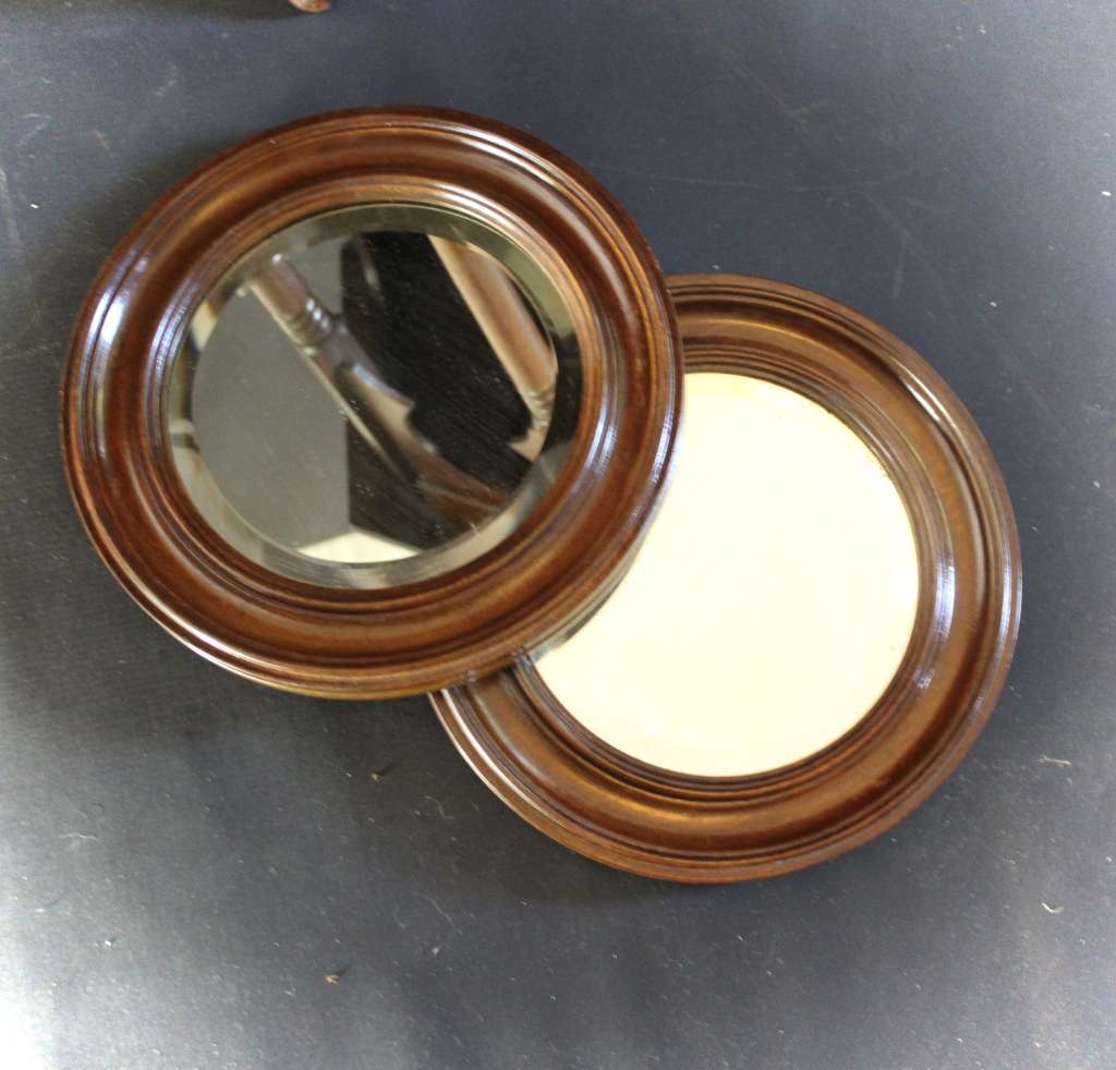 pair of oak framed circular mirrors