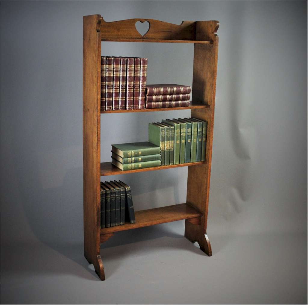 Arts and Crafts oak pierced heart open bookcase