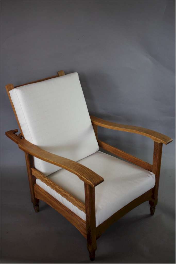 Pair of oak reclining armchairs in the manner of Heals c1920's