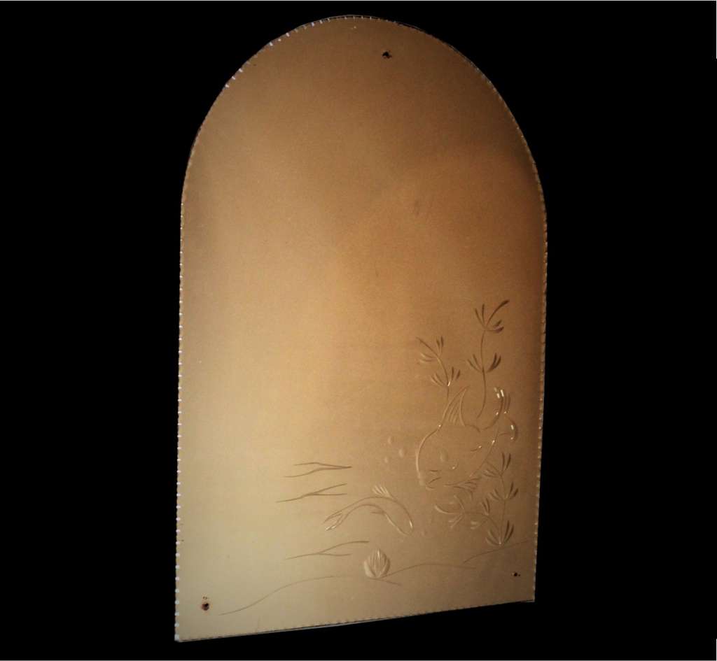 Art Deco arched peach mirror, with fish related design