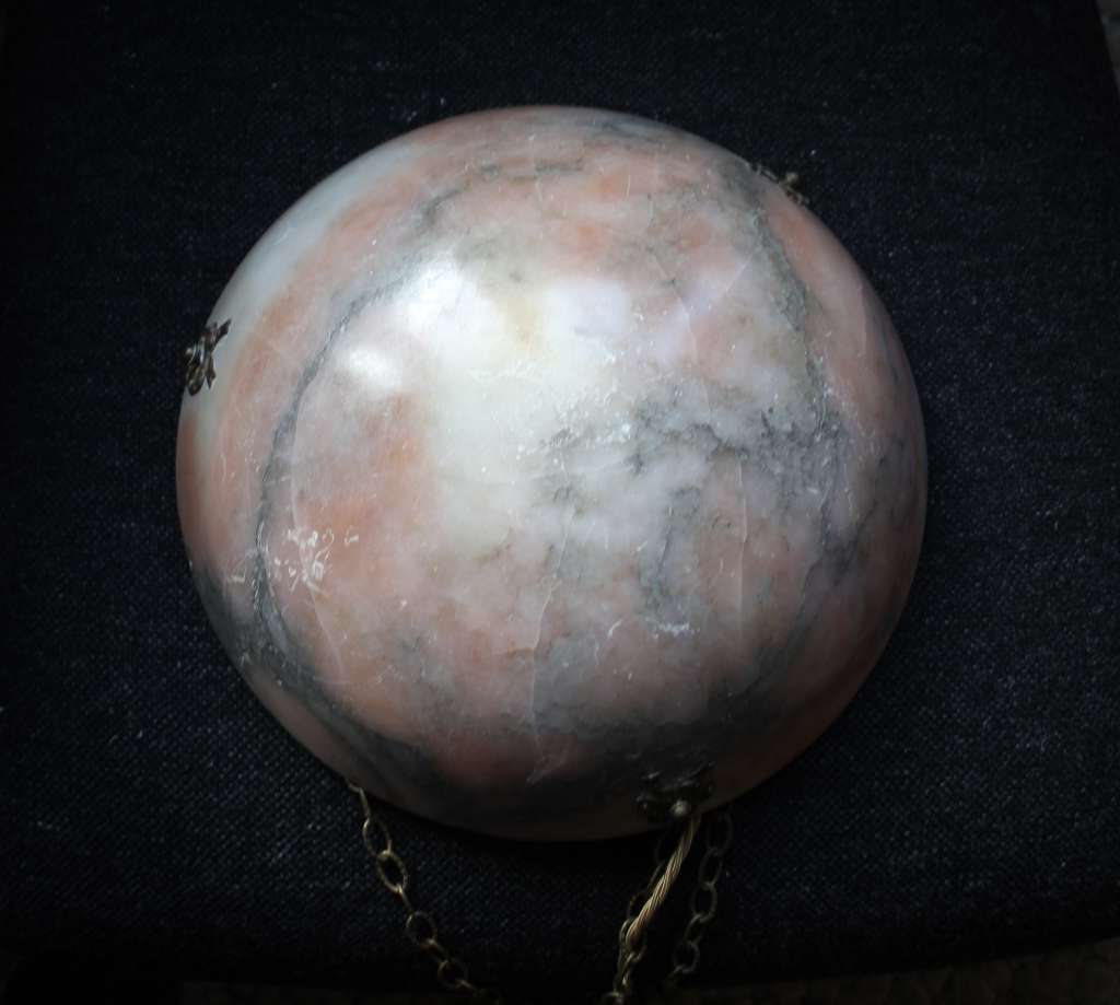 Alabaster ceiling shade with pinkish grain.