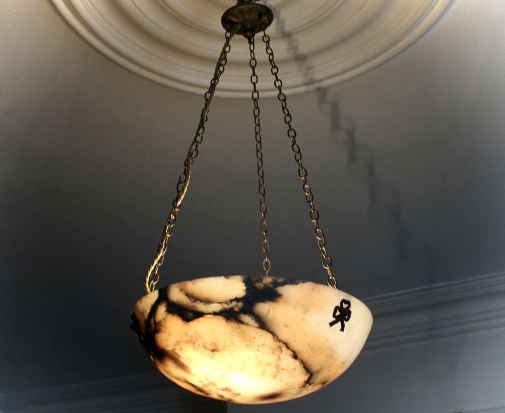 Alabaster ceiling shade with pinkish grain.