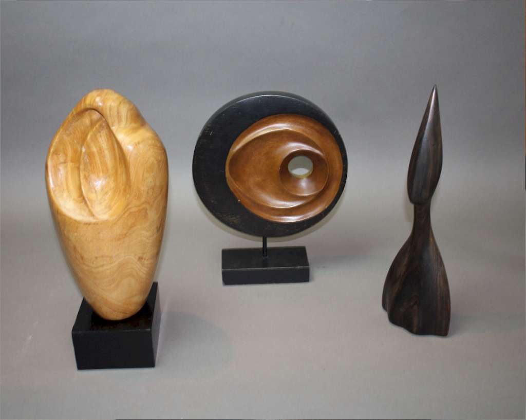 Mid century sculpture in wood on stand.