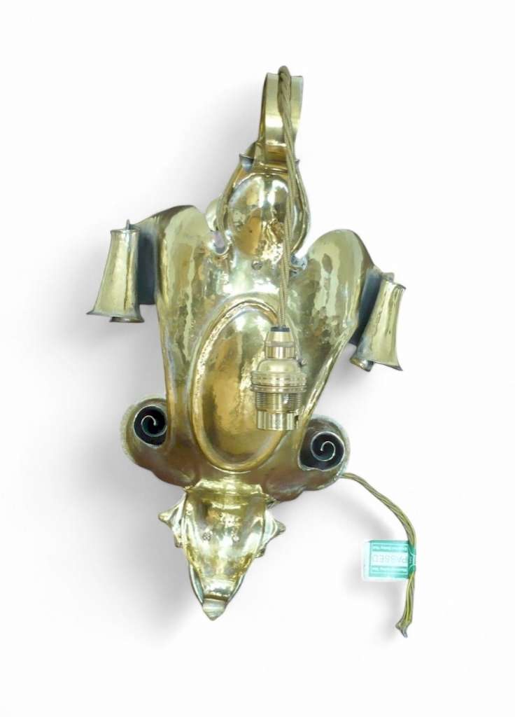 Spectacular arts and crafts wall light in hammered brass