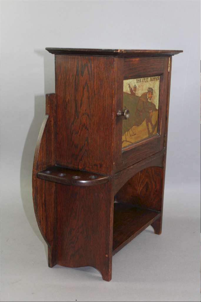 Arts and Crafts oak smokers cabinet by Liberty & Co c1900 with Golfing picture panel