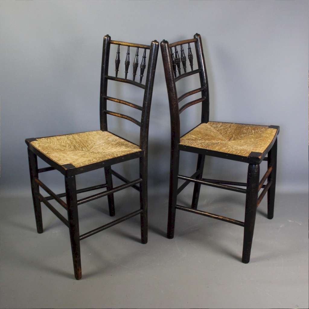 Sussex chairs a near pair by Morris & Co