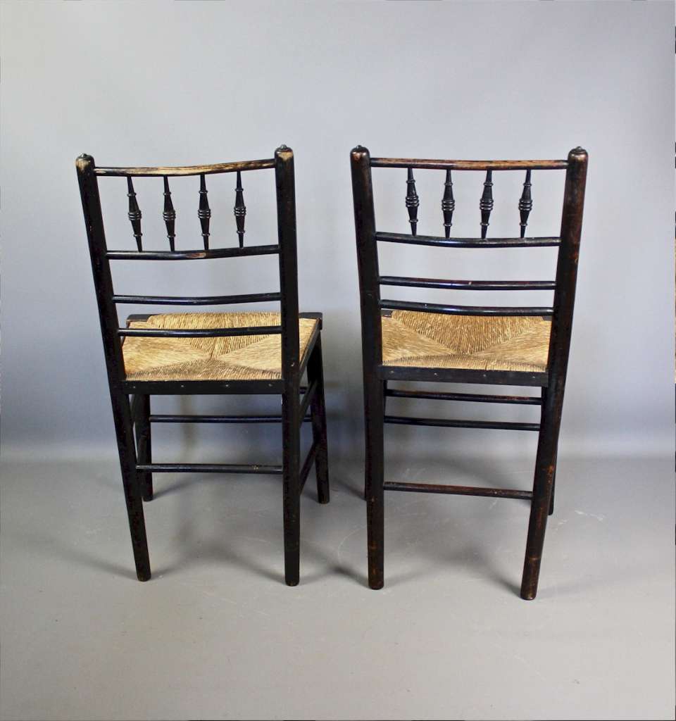 Sussex chairs a near pair by Morris & Co