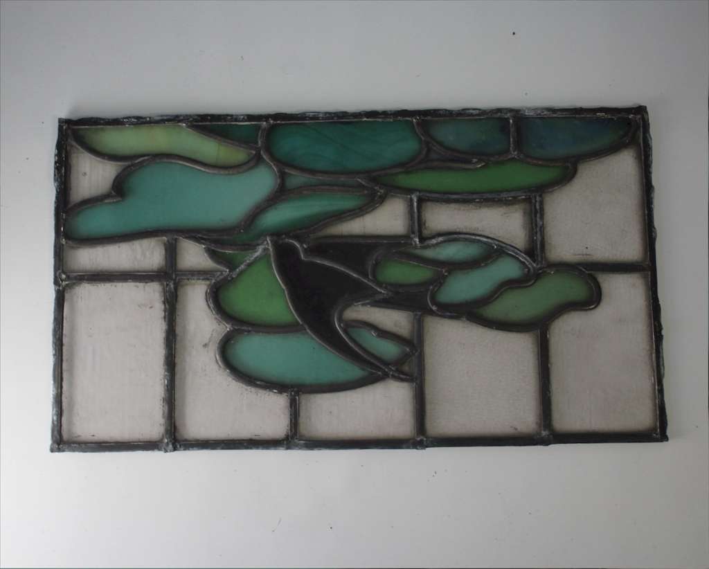Arts and Crafts stained glass panel with Swallow