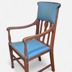 Arts and crafts armchair with carved heart decoration