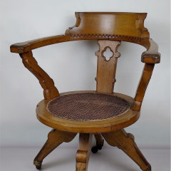 Gothic revival swivel desk chair in honey oak