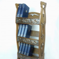 Arts and crafts bookcase with repoussee decoration