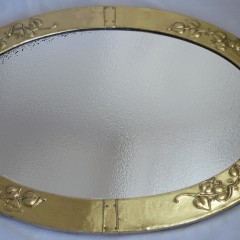Large arts and crafts mirror in brass