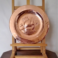 Newlyn arts and crafts charger in hammered copper
