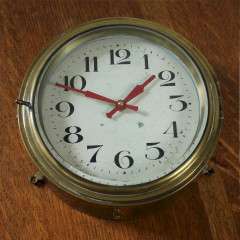 Antique brass Ships clock with  Arabic numerals