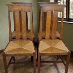 Arts and crafts oak dining chairs by Liberty