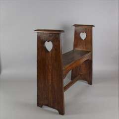 Liberty & Co oak window / hall seat , pierced heart cut-out c1900