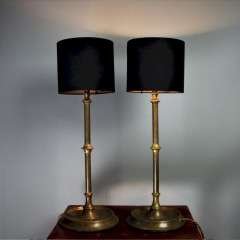 Pair of brass table lamps on circular bases