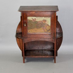 Arts and Crafts oak smokers cabinet by Liberty & Co c1900 with Golfing picture panel