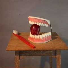 Oversized advertising set of teeth and toothbrush