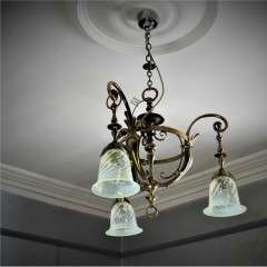 Arts and crafts brass hanging lamp with vaseline shades.