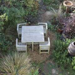 Weathered teak garden set retailed through Heals