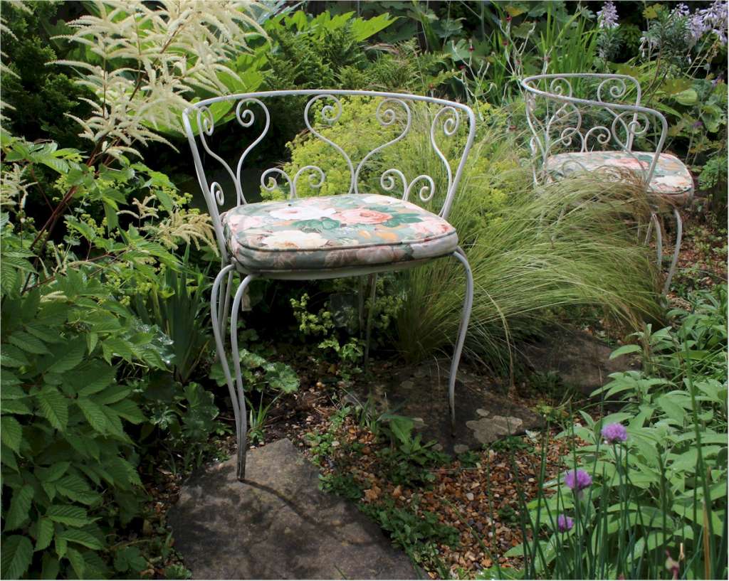 Pair of decorative metal garden chairs