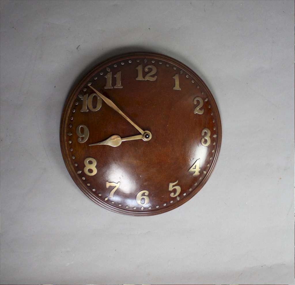 1930's concave  wall clock in walnut with  brass numerals, by Zenith